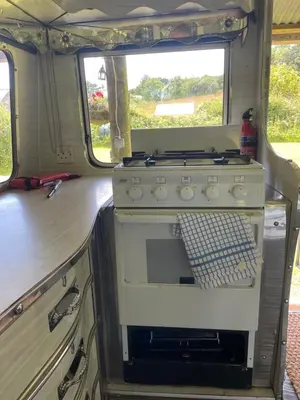 an old stove in the back of an rv at The Quarry Caravan in Falmouth