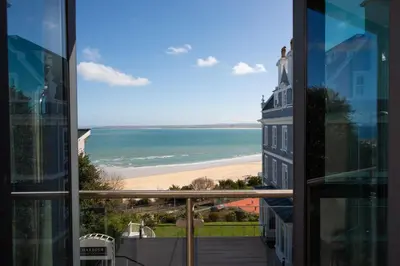 a view of the beach from the balcony of a condo at Apartment 3 at Porthminster Mews in St Ives
