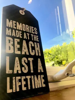 a sign that says memories made at the beach last extra furniture at Trevone Bay Seaside Home For 4 - Close To Beach and Padstow in Padstow