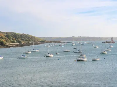 a large group of boats sitting in the water at Kensa in Redruth