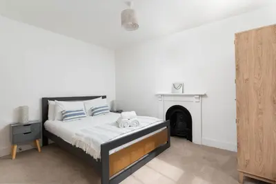 a bedroom with a bed with two stuffed animals on it at Marazion Charming Retreat for 6 with Social Garden in Marazion