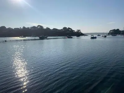 a large body of water with boats in it at Luxury retreat with hot tub & wood burner - Mylor in Falmouth