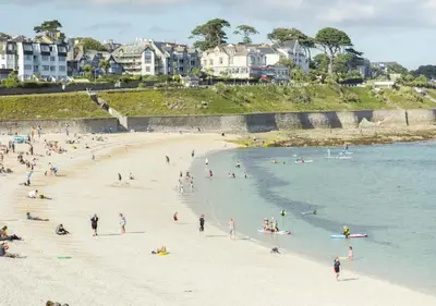 a group of people on a beach in the water at Luxury retreat with hot tub & wood burner - Mylor in Falmouth