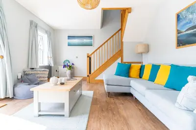 a living room with a couch and a table at Chyvounder in St. Agnes