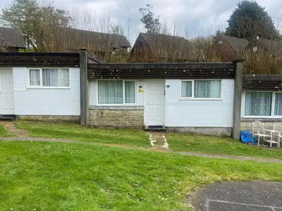 a house with a grass yard in front of it at Villa Sleeps 4 with Free Parking in Camelford
