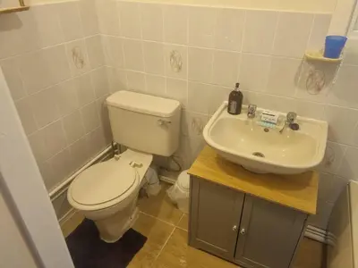 a bathroom with a toilet and a sink at Villa Sleeps 4 with Free Parking in Camelford