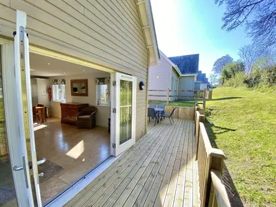 a porch of a house with a sliding glass door at Trewhiddle Retreat V1 by Together Travel - Luxury 4-Bedroom Villa in St Austell