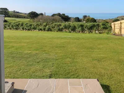 a large grassy yard with a field of grass at Greenside Studio in Penzance