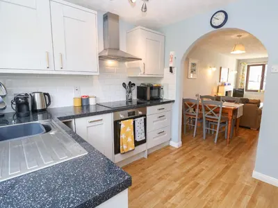 a kitchen with a sink and a counter top at Bumbles in Padstow