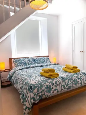 a bedroom with a bed with yellow bananas on it at The Post House in Charlestown