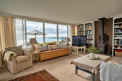 a living room with a couch and a tv at Finest Retreats - Lesceave Cottage in Praa Sands