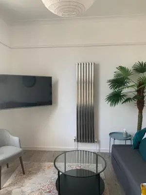 a living room with a couch and a glass table at Harbour View in St Ives