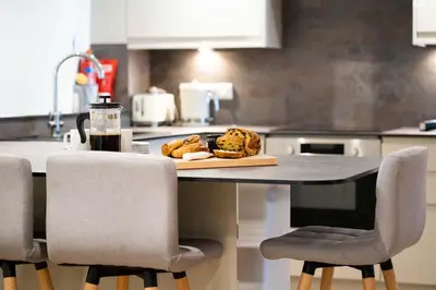 a table in a kitchen with a plate of food on it at The Boathouse in St Ives