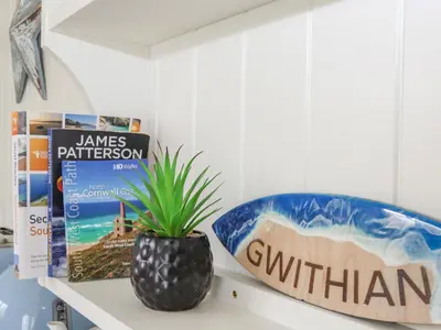 a counter top with a bowl and a plant on it at Gwithian Shepherds Hut in Hayle